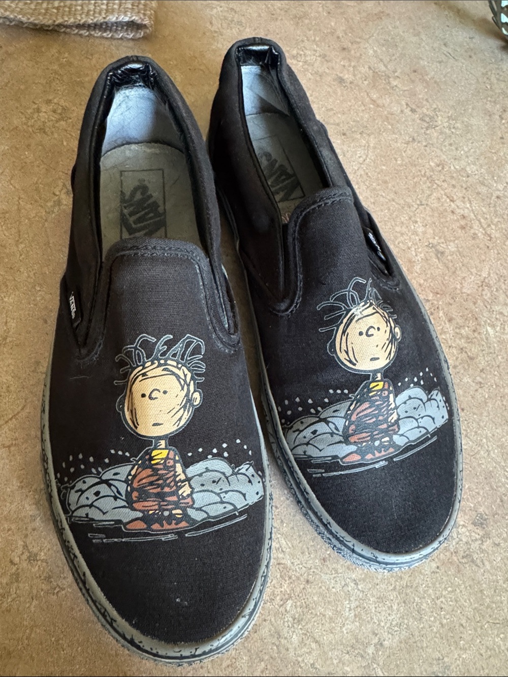 Vans Peanuts PigPen Women’s Black Slip-On Sneakers with Cartoon Graphic